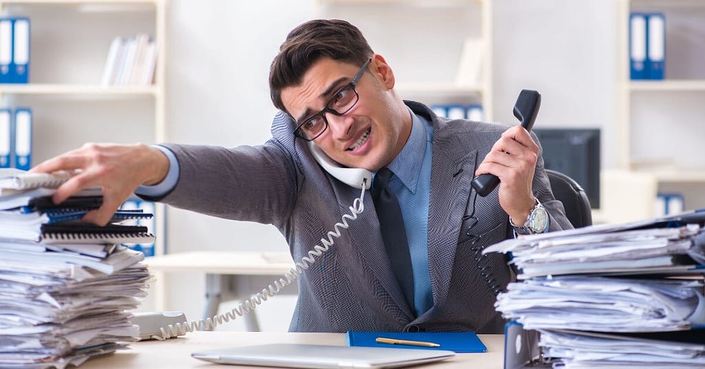 Exhausted employee suffering from burnout in a high-pressure work environment