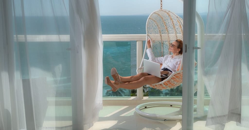 remote worker using laptop in different spots around house