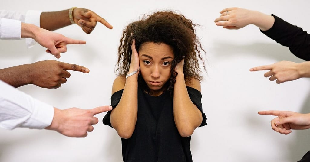 Employees pointing fingers after a mistake in a toxic blame culture